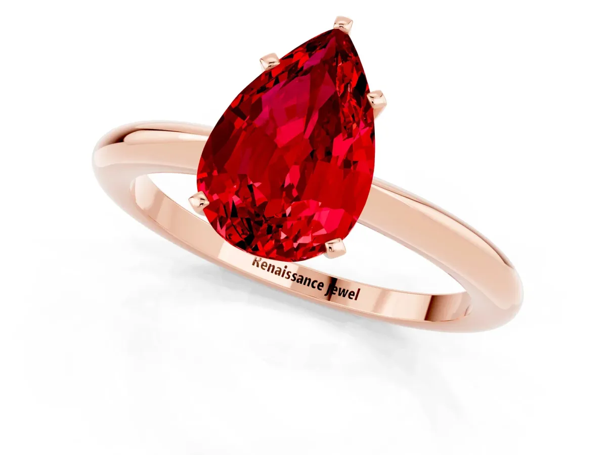 Pear Cut Ruby Solitaire Ring with Six-Prong Setting and Classic Band Rose gold