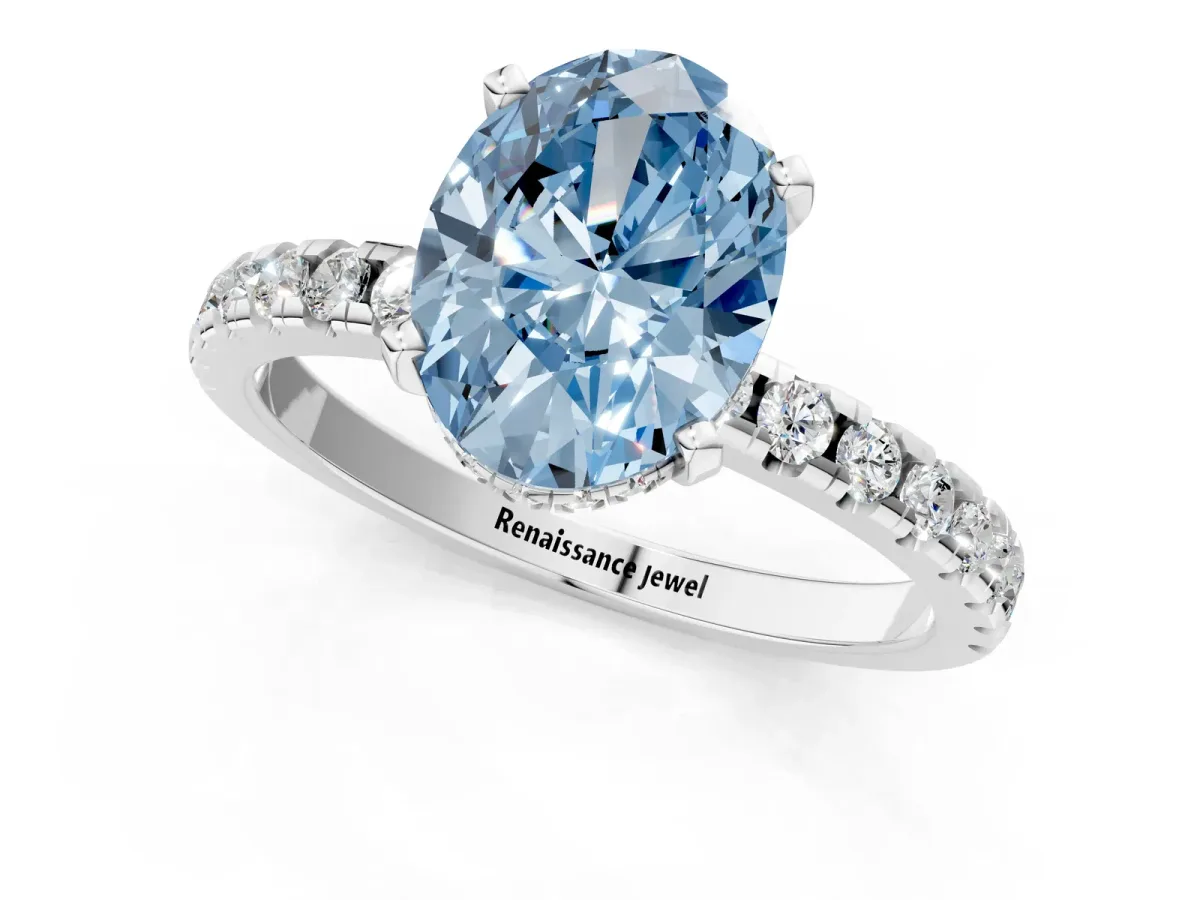 Fancy Blue Oval Cut Diamond Solitaire Ring with Round Pavé Band and Four-Prong Setting Silver