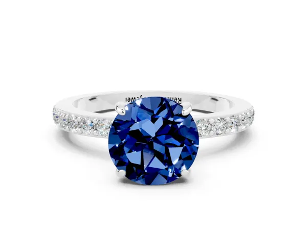 Round Cut Blue Sapphire Solitaire Engagement Ring with Pavé Band and Four-Prong Setting Platinum
