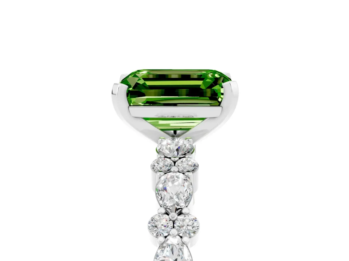 Emerald Cut Peridot Side Stone Solitaire Ring with Round and Four-Prong Setting Silver