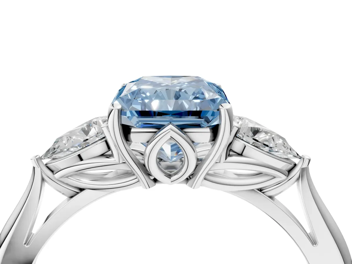 Fancy Blue Three-Stone Radiant Cut Diamond Ring with Pear Side Stones in Four-Prong Setting Platinum
