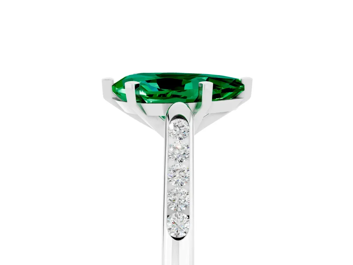 Pear Cut Emerald Solitaire Ring with Channel Set Round Band and Prong Setting Silver