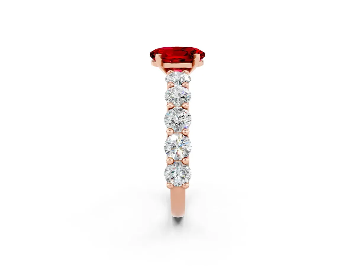 Oval Cut Ruby Prong Setting with Side Stones on a Pave Band Rose gold