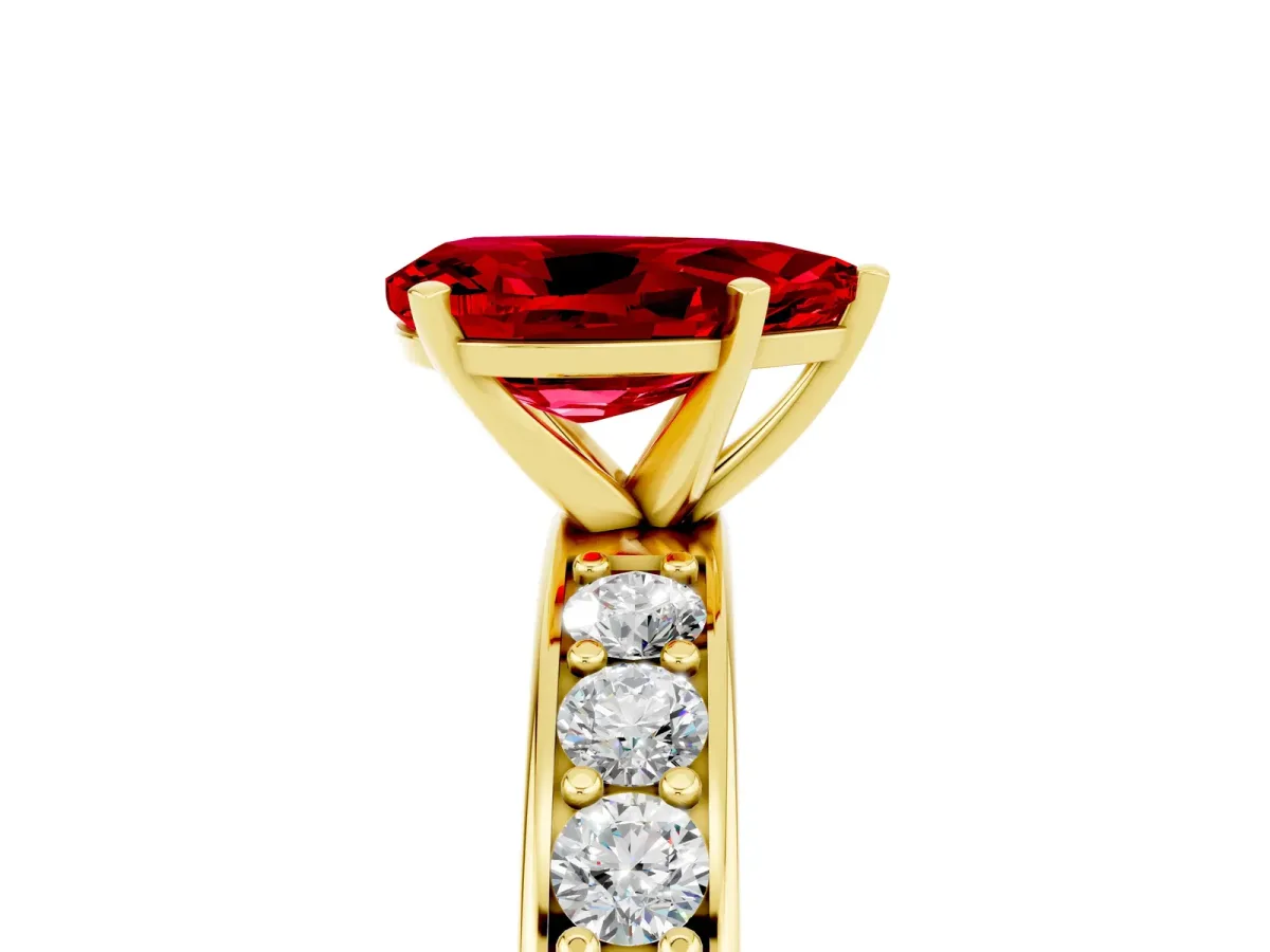 Pear Cut Ruby Engagement Ring with Channel Set Round Band and Prong Setting Yellow gold