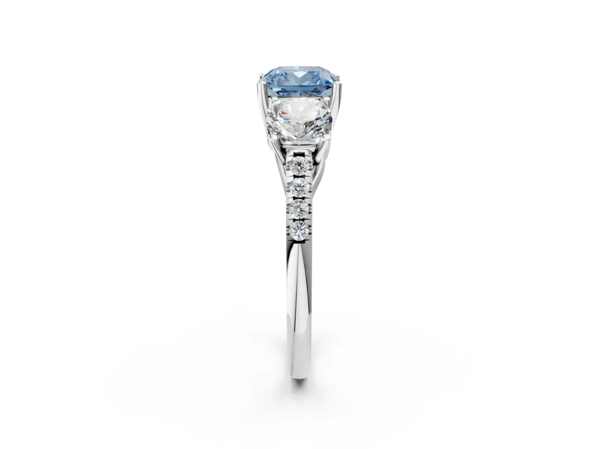 Fancy Blue Three-Stone Cushion Cut Diamond Ring with Round Pavé Band and Prong Setting Silver