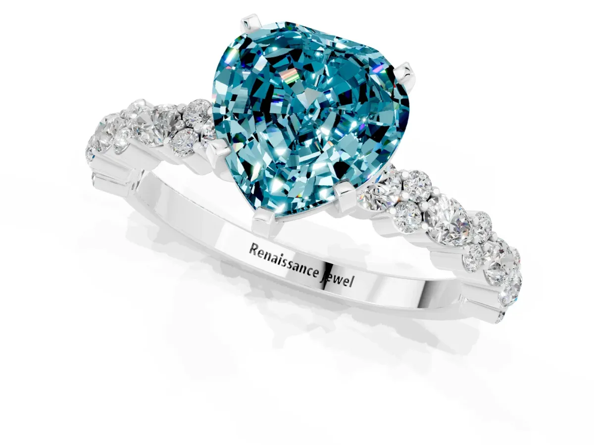 Heart Cut Blue Topaz Side Stone Solitaire Ring with Round and Four-Prong Setting Silver
