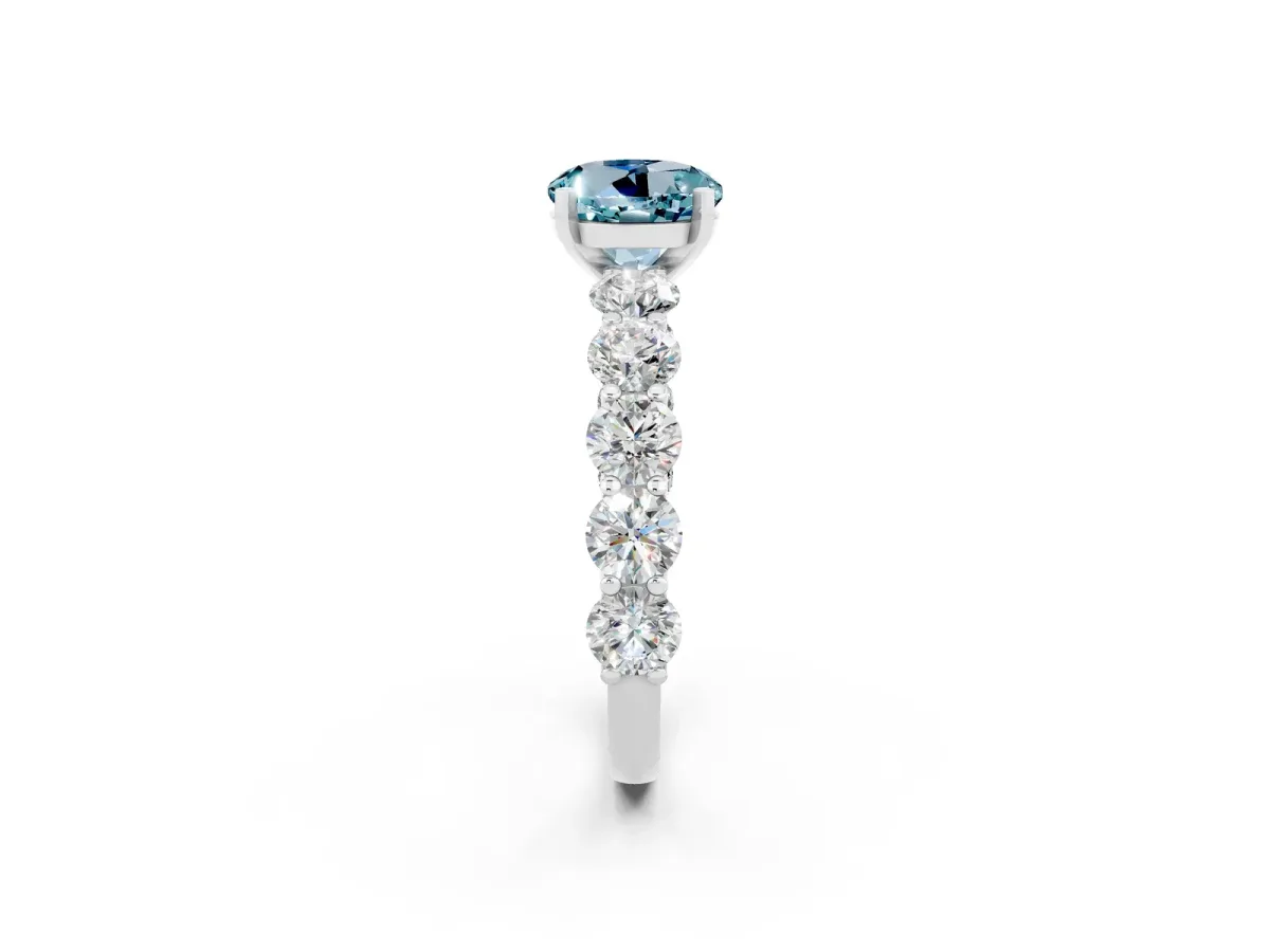 Round Cut Aquamarine Prong Setting with Side Stones on a Pave Band Silver
