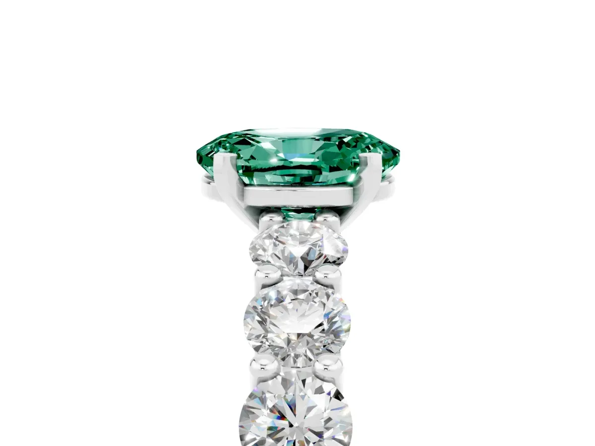 Oval Cut Green Sapphire Prong Setting with Side Stones on a Pave Band Silver