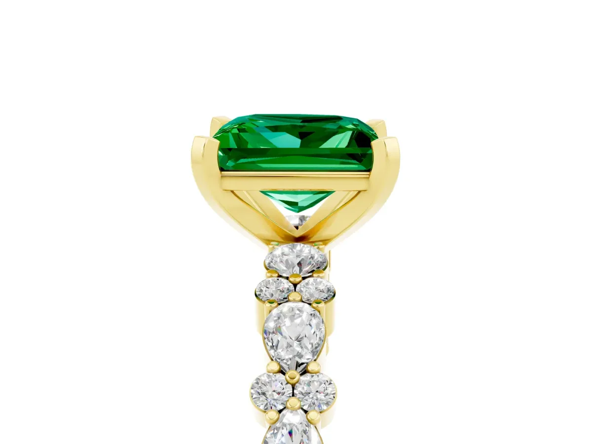 Princess Cut Emerald Side Stone Solitaire Ring with Round and Four-Prong Setting Yellow gold