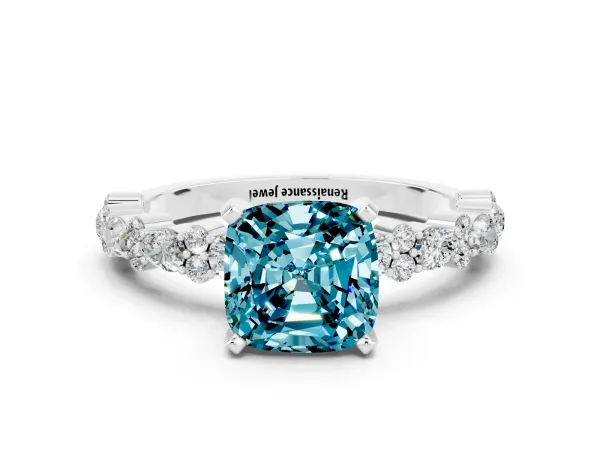 Cushion Cut Blue Topaz Side Stone Solitaire Ring with Round and Four-Prong Setting Platinum
