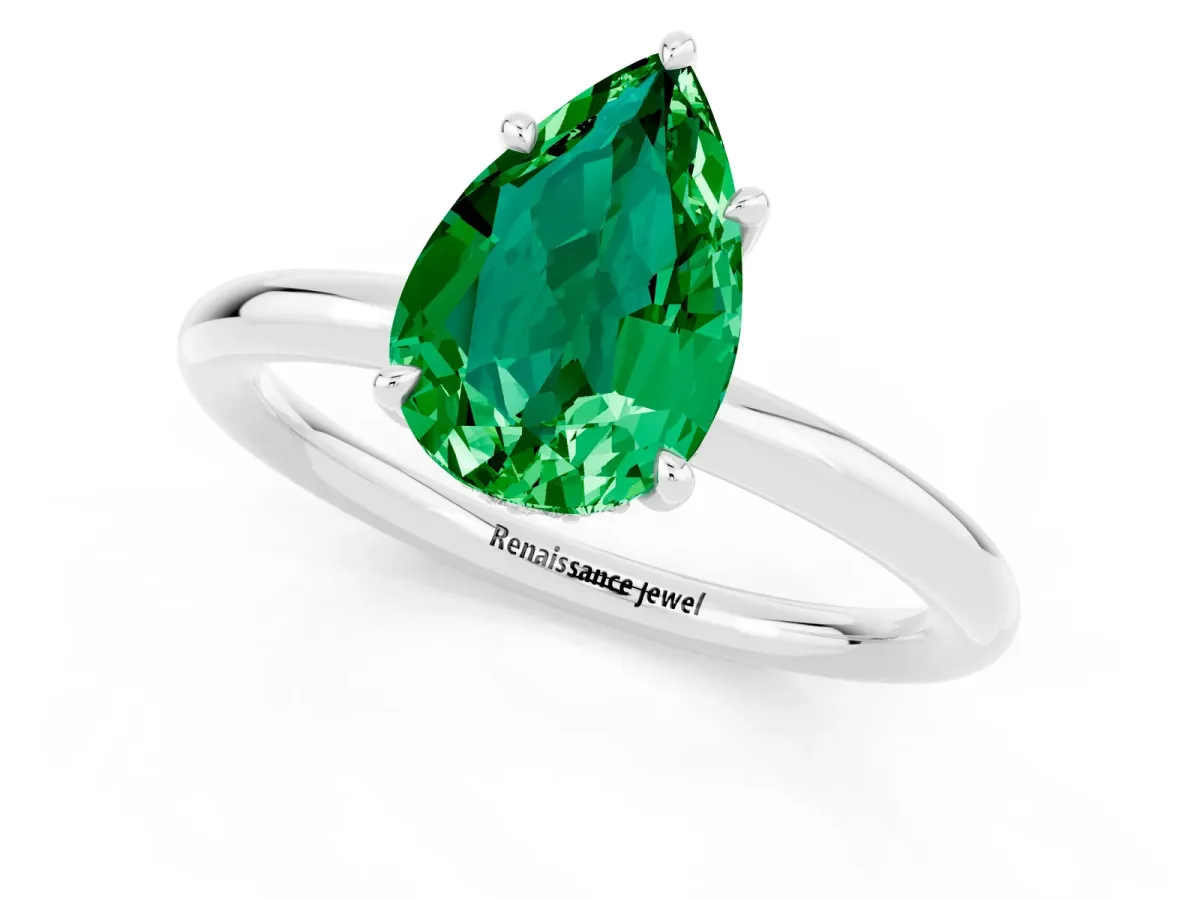 Pear Cut Emerald Solitaire Ring with Thin Band and Four-Prong Setting Silver