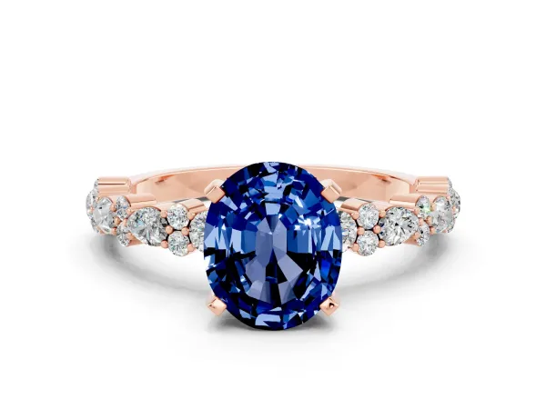 Oval Cut Blue Sapphire Side Stone Solitaire Ring with Round and Four-Prong Setting Rose gold