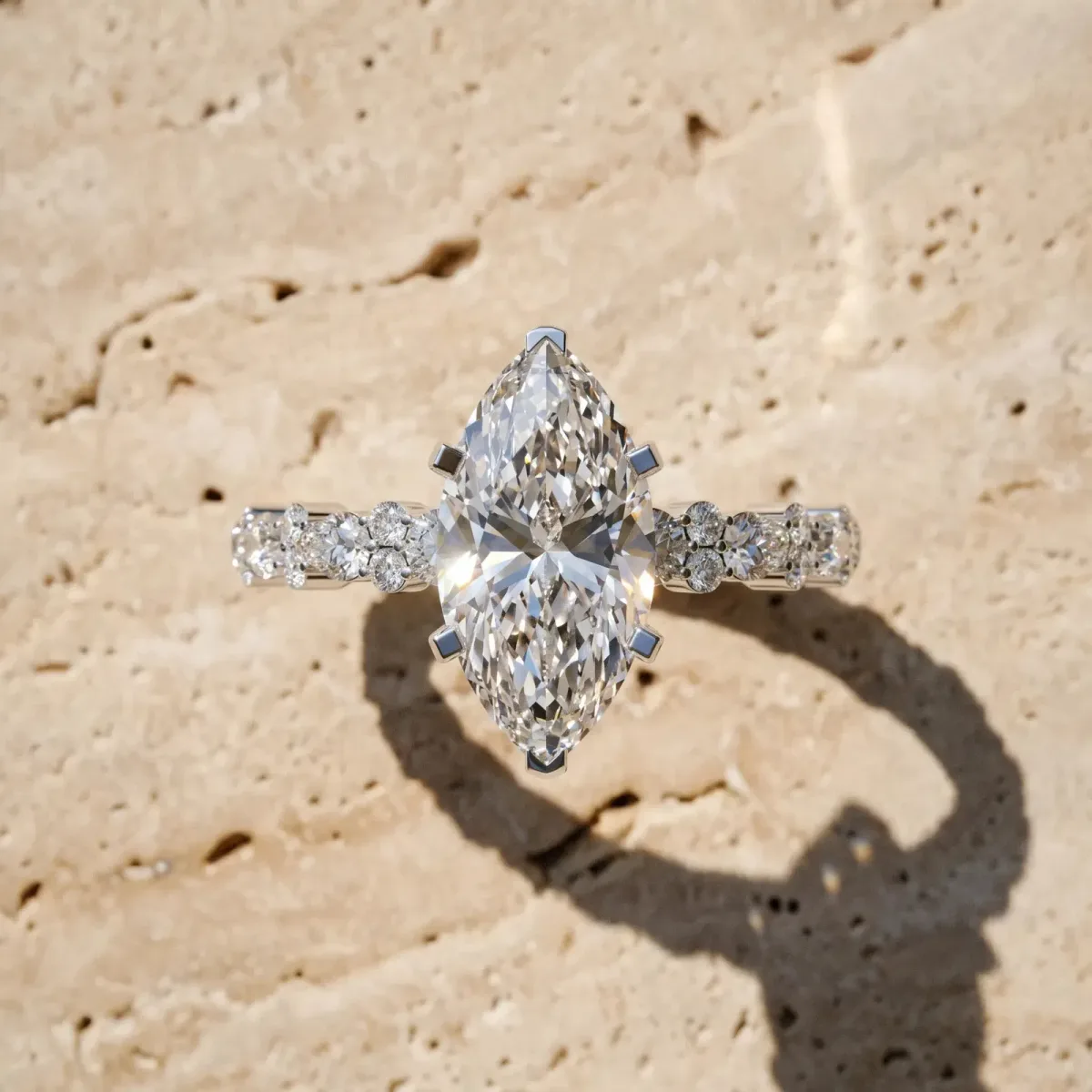 Marquise Cut Diamond Side Stone Solitaire Ring with Round and Four-Prong Setting Platinum