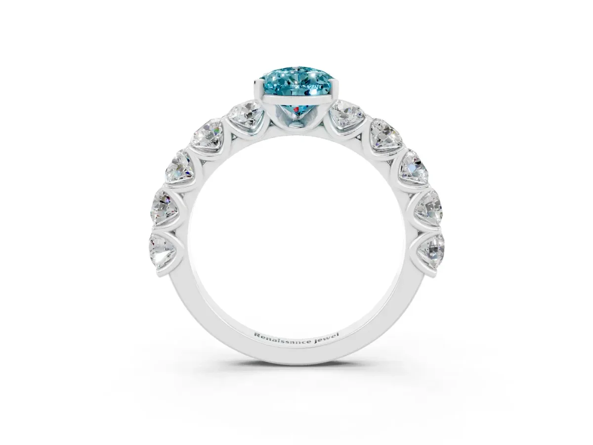 Pear Cut Blue Topaz Prong Setting with Side Stones on a Pave Band Silver