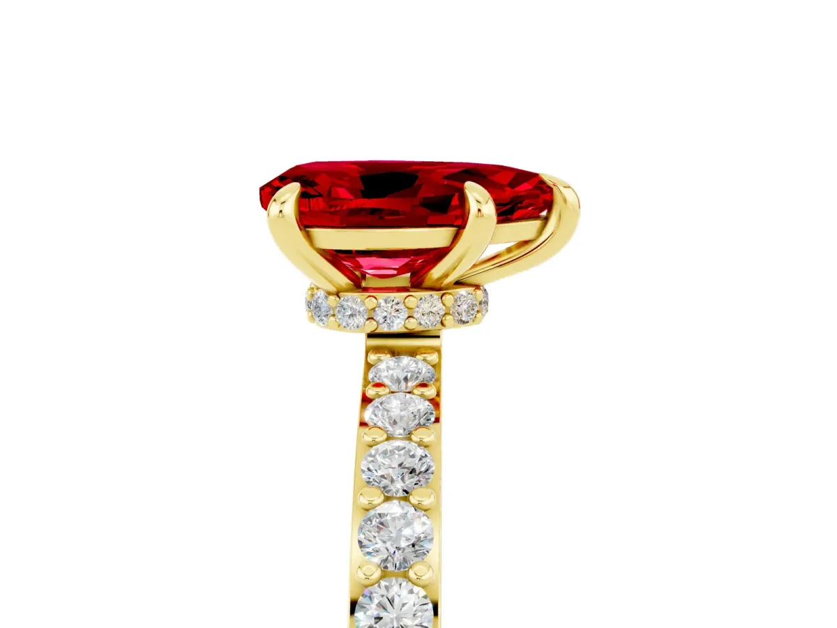 Pear Cut Ruby Solitaire Engagement Ring with Pavé Band and Four-Prong Setting Yellow gold