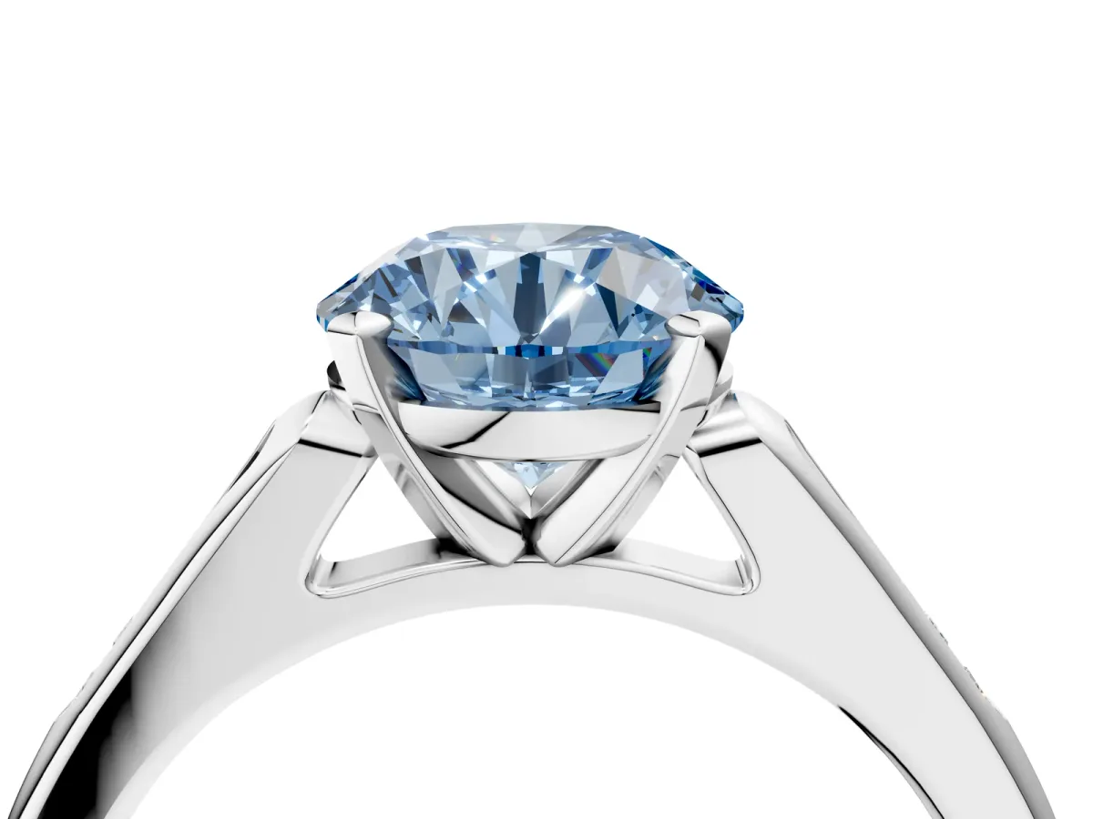 Fancy Blue Round Cut Diamond Solitaire Ring with Channel Set Round Band and Prong Setting Silver