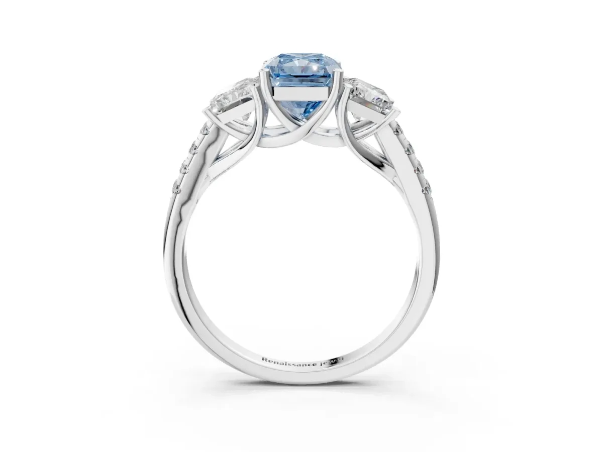 Fancy Blue Three-Stone Radiant Cut Diamond Ring with Round Pavé Band and Prong Setting Silver