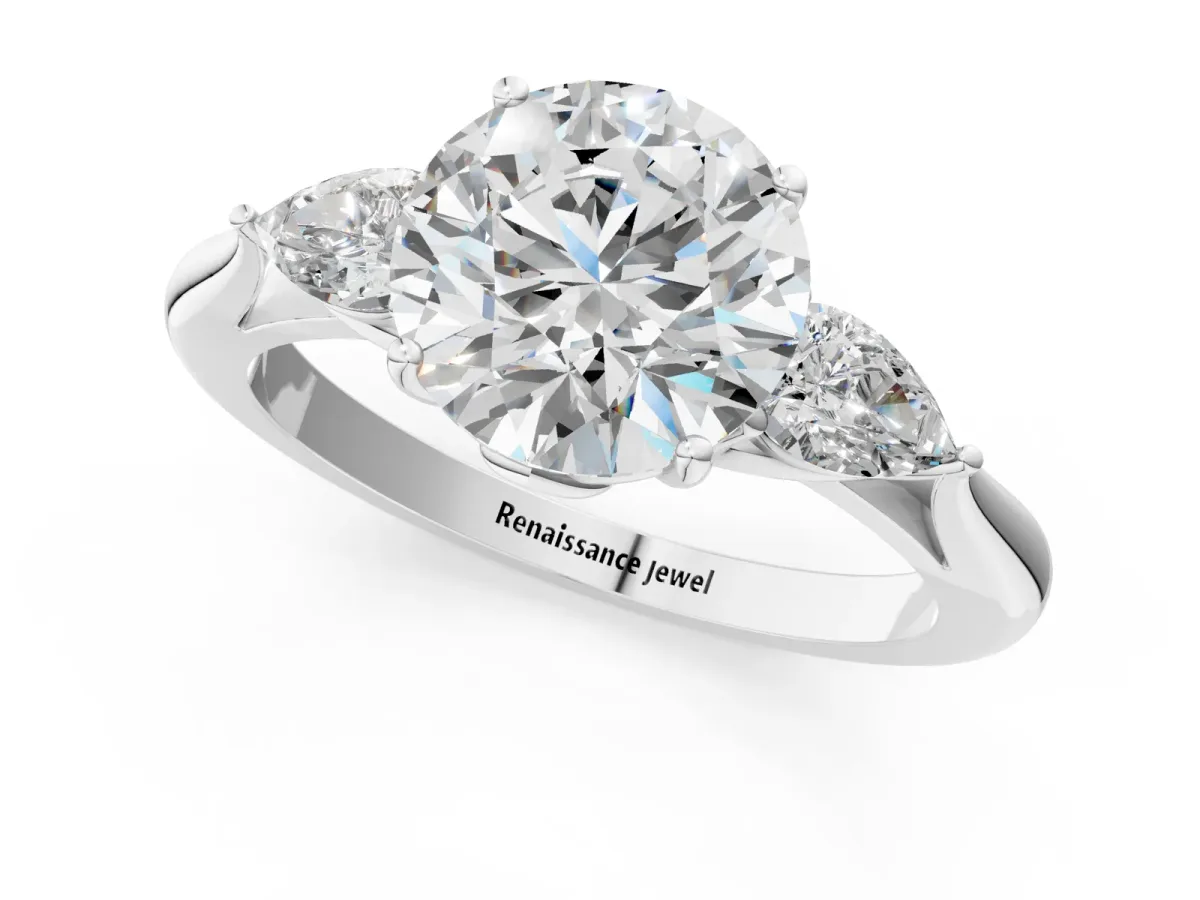 Three-Stone Round Cut Diamond Ring with Pear Side Stones in Four-Prong Setting Platinum