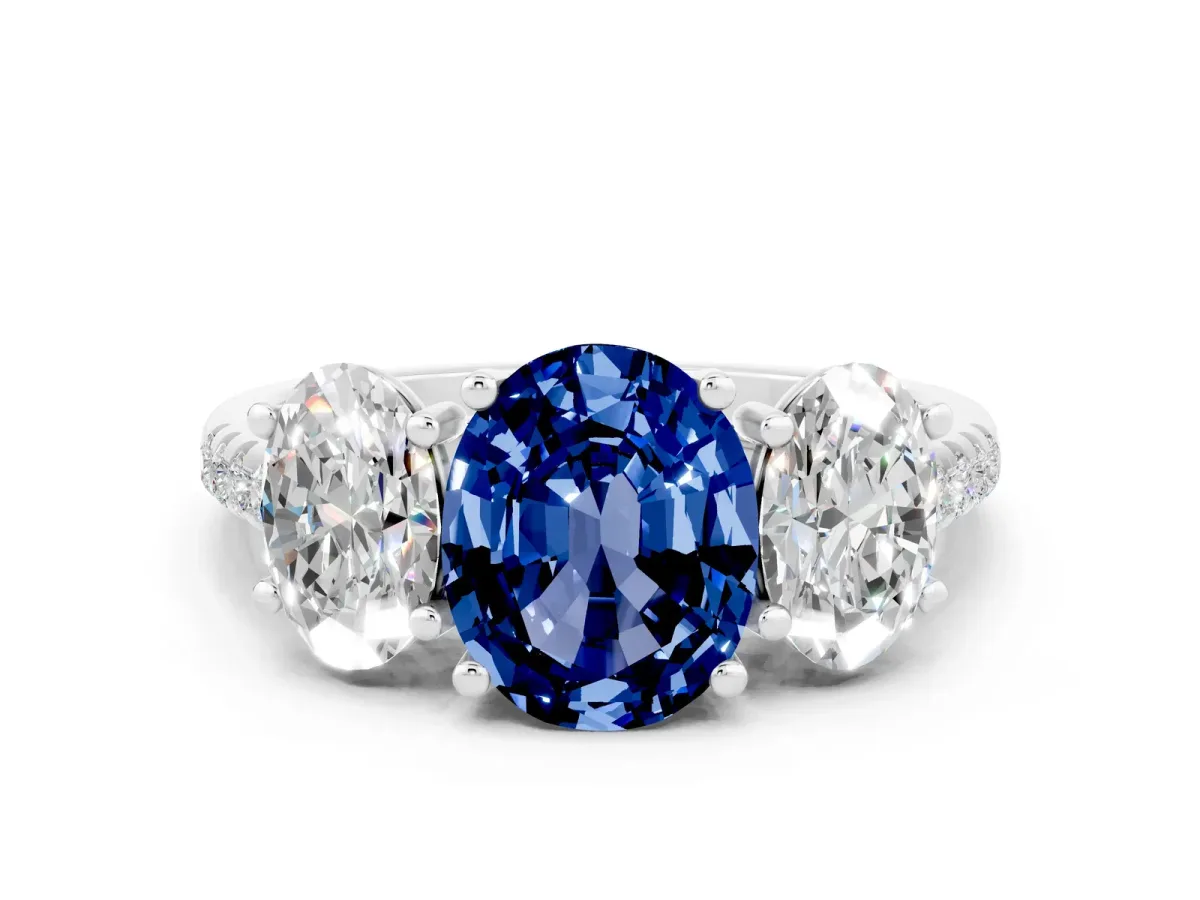 Three-Stone Oval Cut Blue Sapphire Ring with Round Pavé Band and Prong Setting Silver
