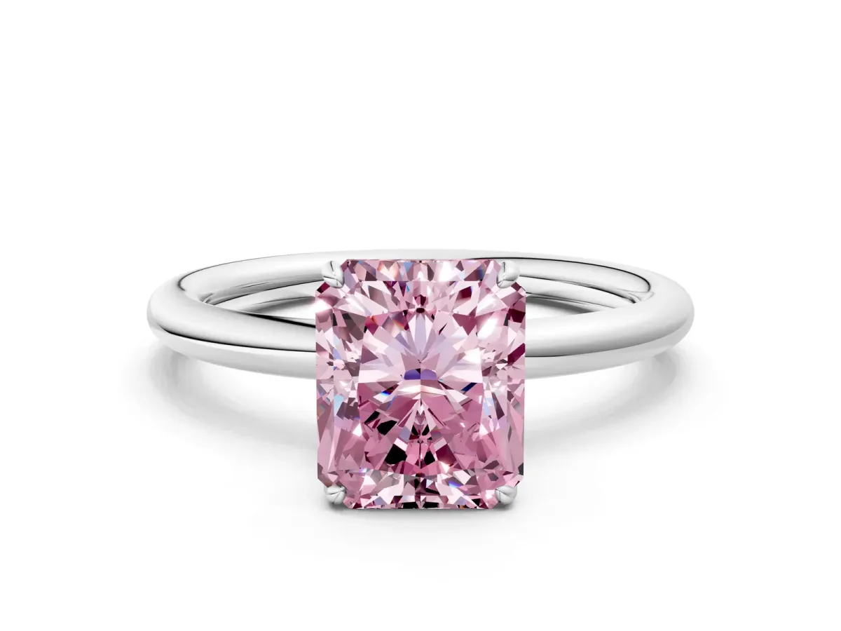 Fancy Pink Radiant Cut Solitaire Diamond Ring with Four-Prong Setting on a Plain Band Platinum