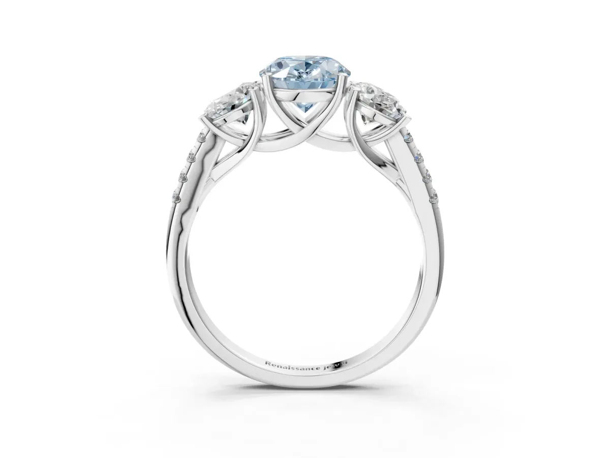 Fancy Blue Three-Stone Oval Cut Diamond Ring with Round Pavé Band and Prong Setting Platinum