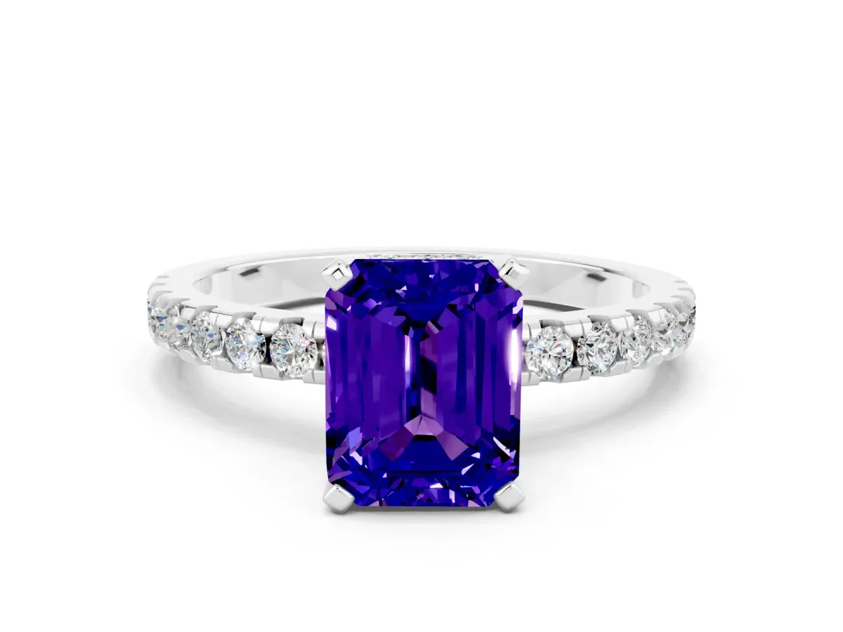 Emerald Cut Tanzanite Solitaire Ring with Round Pavé Band and Four-Prong Setting Silver