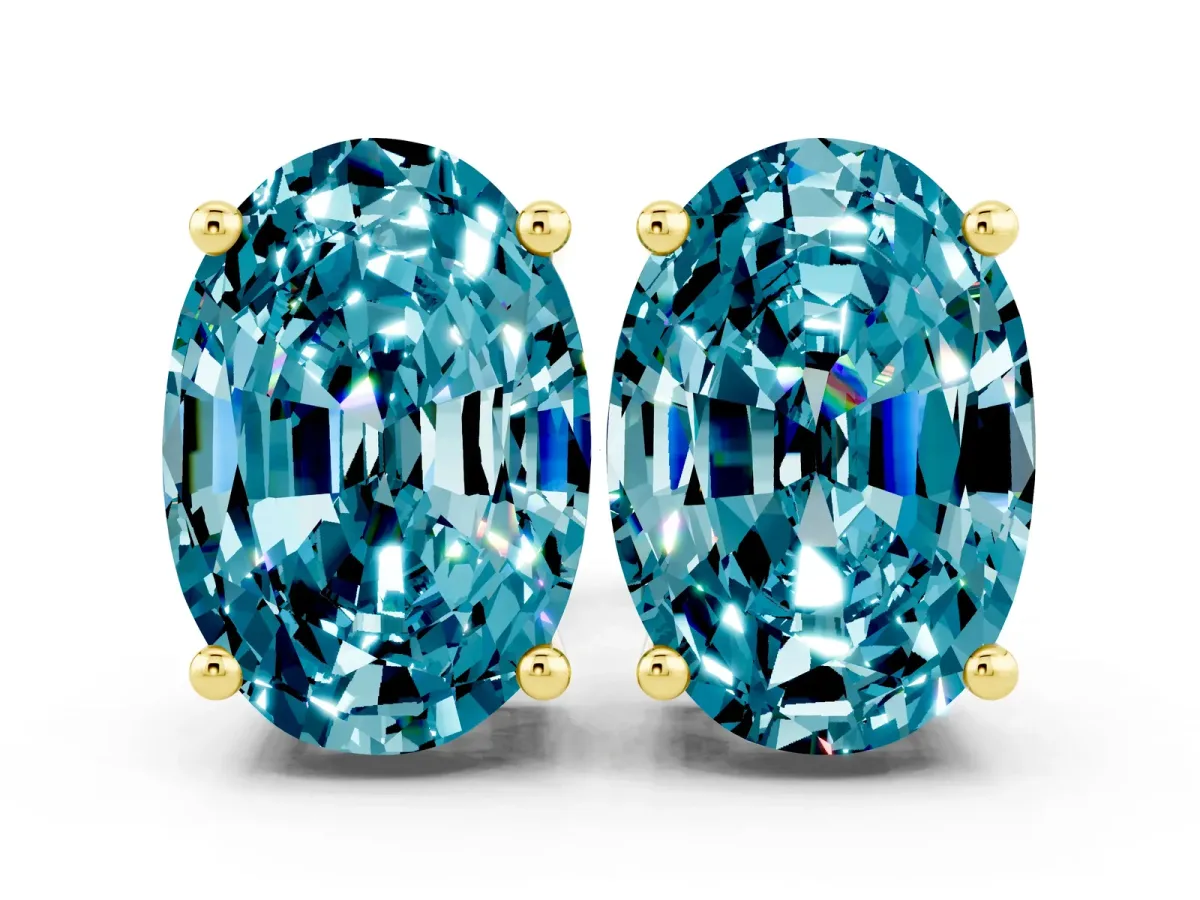 Oval Cut Blue Topaz Stud Earrings Yellow gold