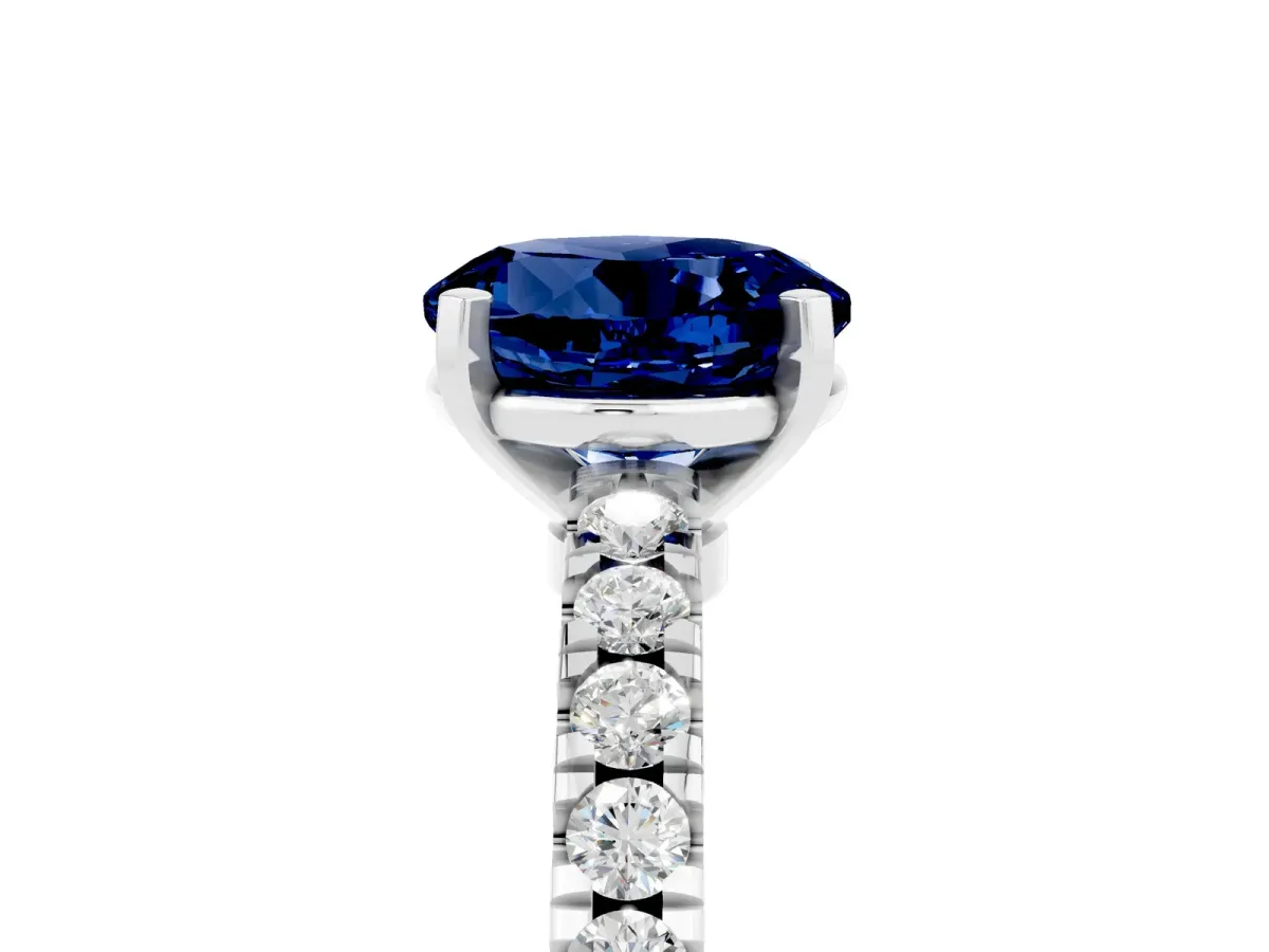 Round Cut Solitaire Blue Sapphire with Pavé Band and Four-Prong Setting Silver