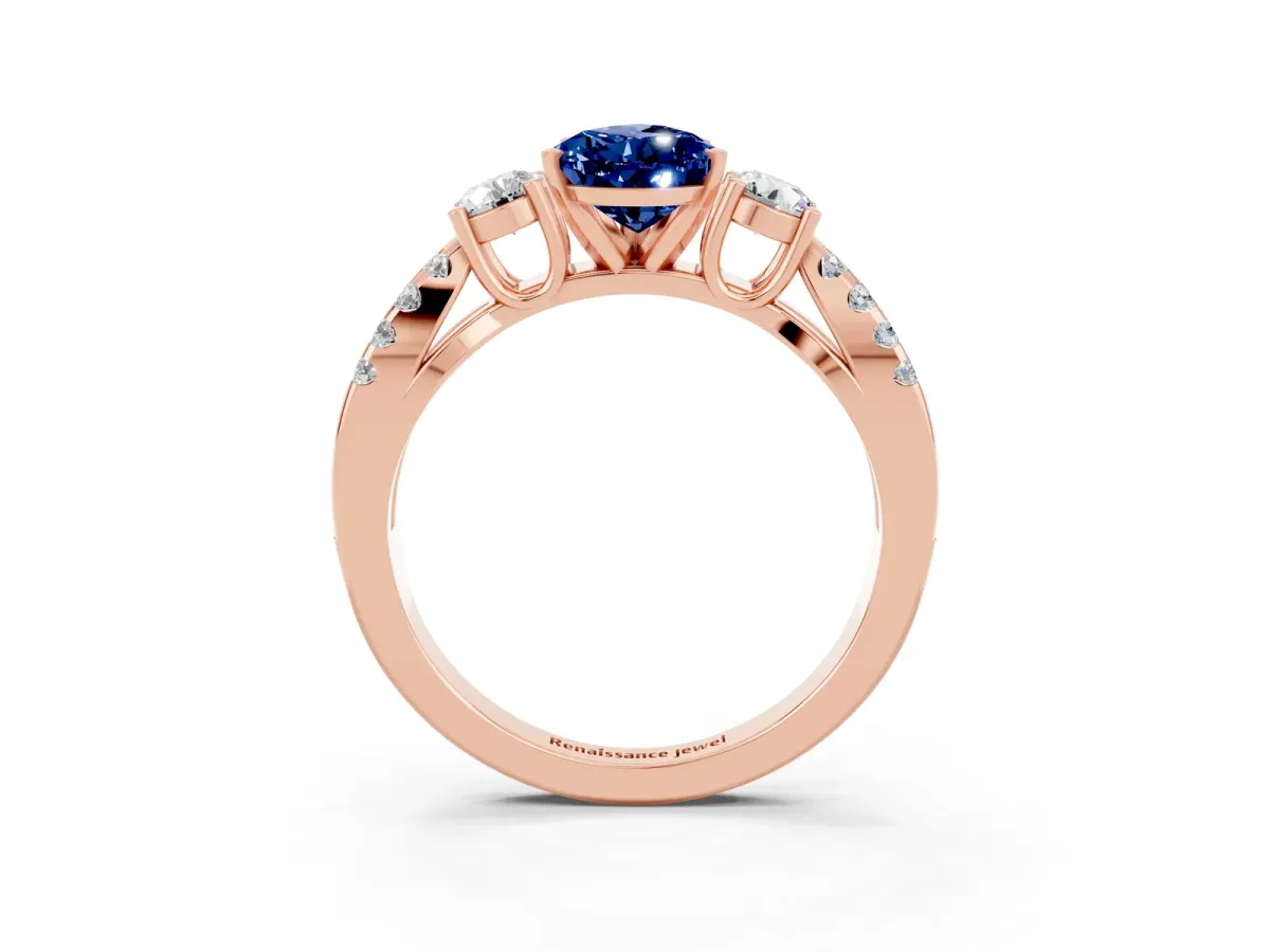 Pear Cut Blue Sapphire Three-Stone Ring with Pavé Split Shank and Four-Prong Setting Rose gold