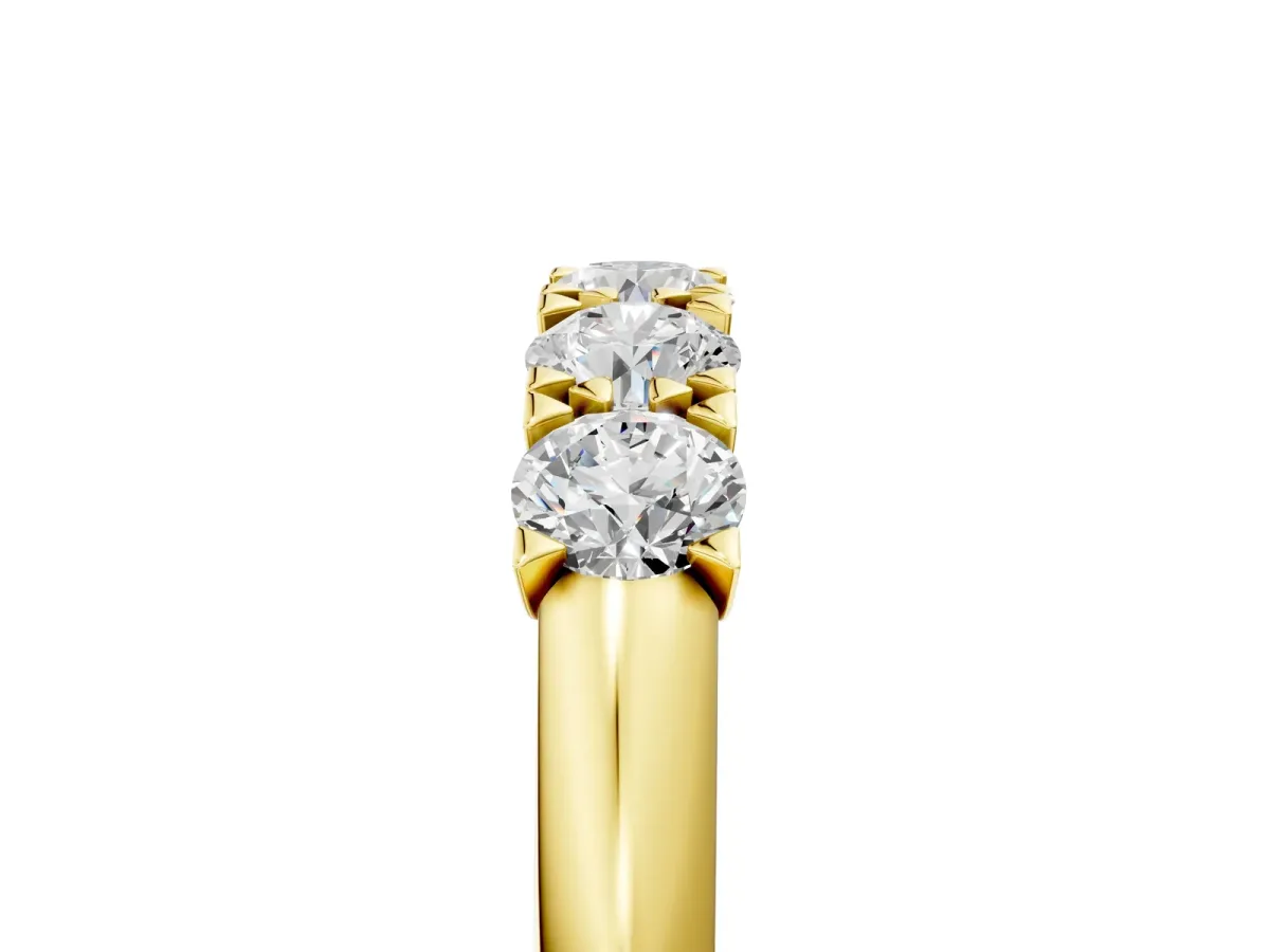 Round Diamond Channel Set Half Eternity Band with Shared Prong Setting Yellow gold
