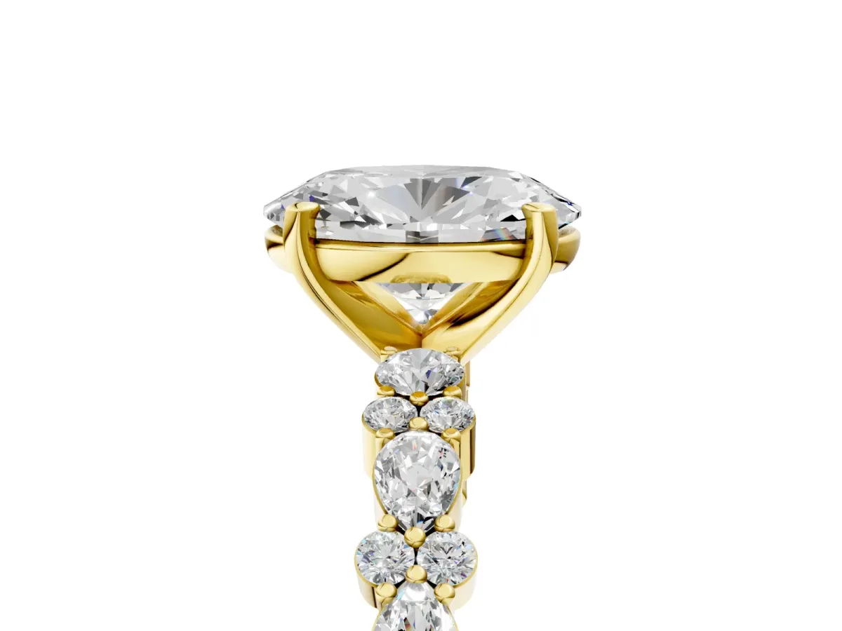 Oval Cut Diamond Side Stone Solitaire Ring with Round and Four-Prong Setting Yellow gold