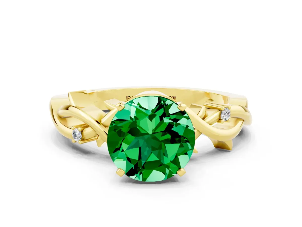 Round Cut Emerald Solitaire Ring with Twisted Band and Prong Setting Yellow gold