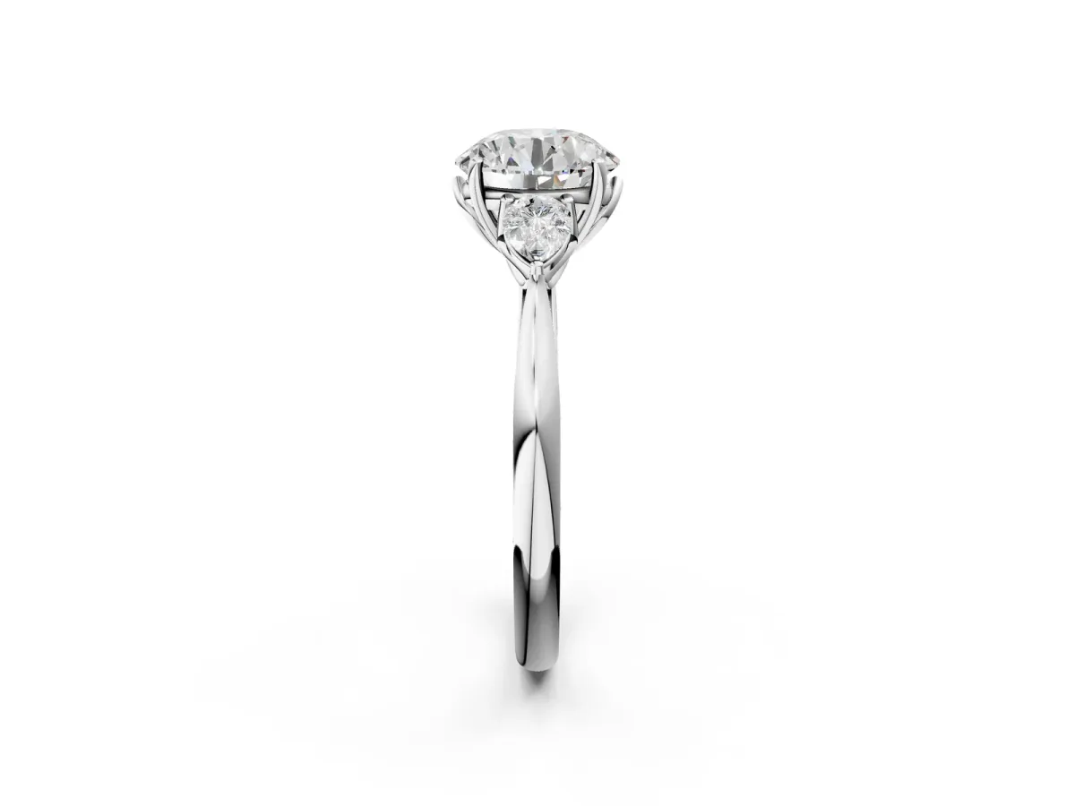 Three-Stone Round Cut Diamond Ring with Pear Side Stones in Four-Prong Setting Platinum