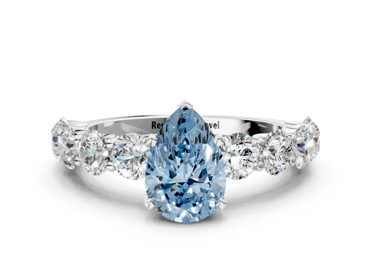 Fancy Blue Pear Cut Diamond Prong Setting with Side Stones on a Pave Band Platinum