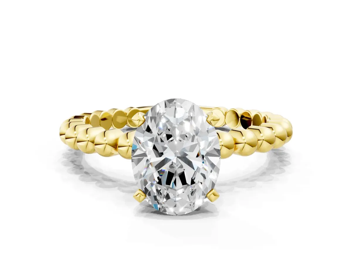 Oval Cut Diamond Solitaire Ring with Beaded Band and Prong Setting Yellow gold