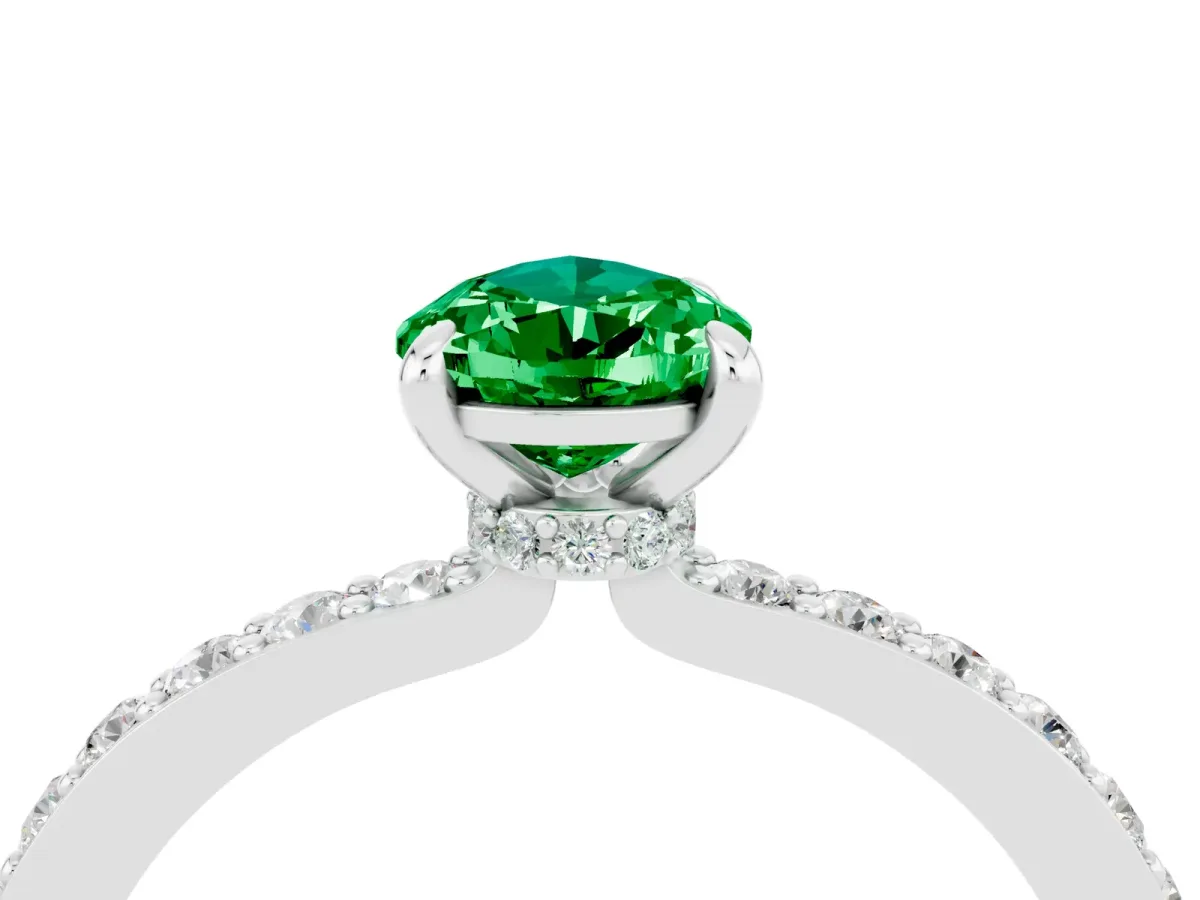 Pear Cut Emerald Solitaire Engagement Ring with Pavé Band and Four-Prong Setting Silver
