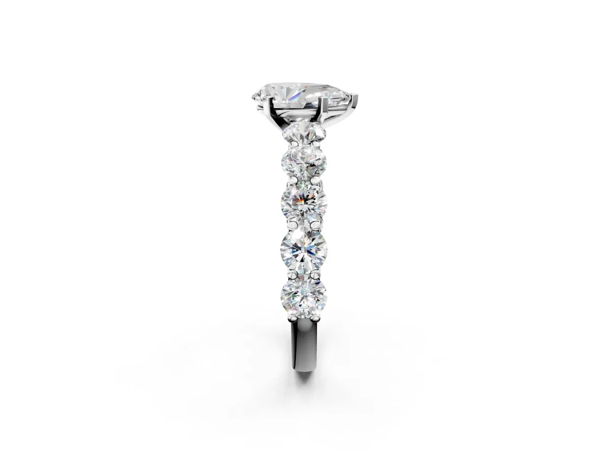 Pear Cut Diamond Prong Setting with Side Stones on a Pave Band Silver