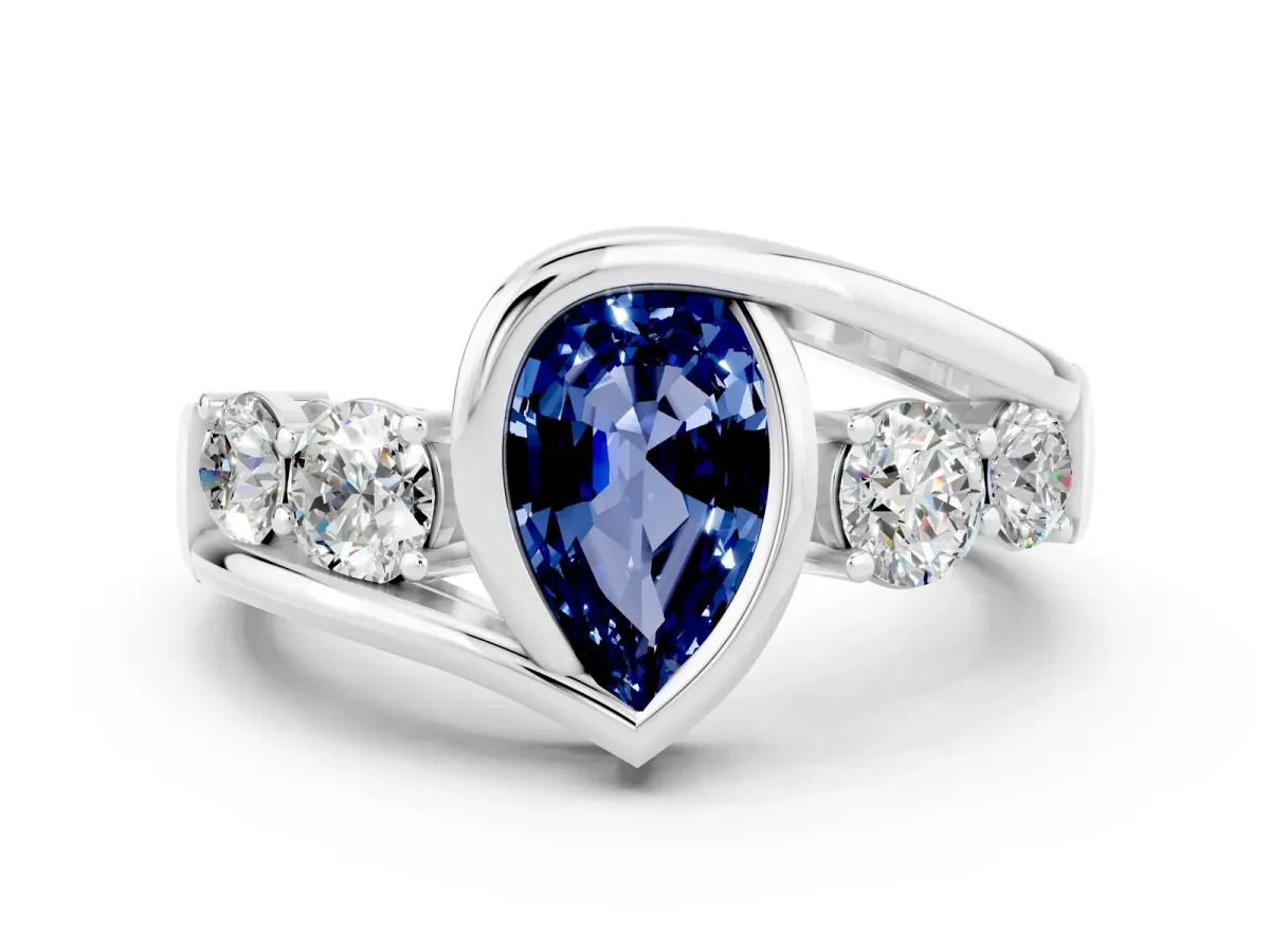 Bezel Set Pear Cut Blue Sapphire Bypass Ring with Round Accents Silver