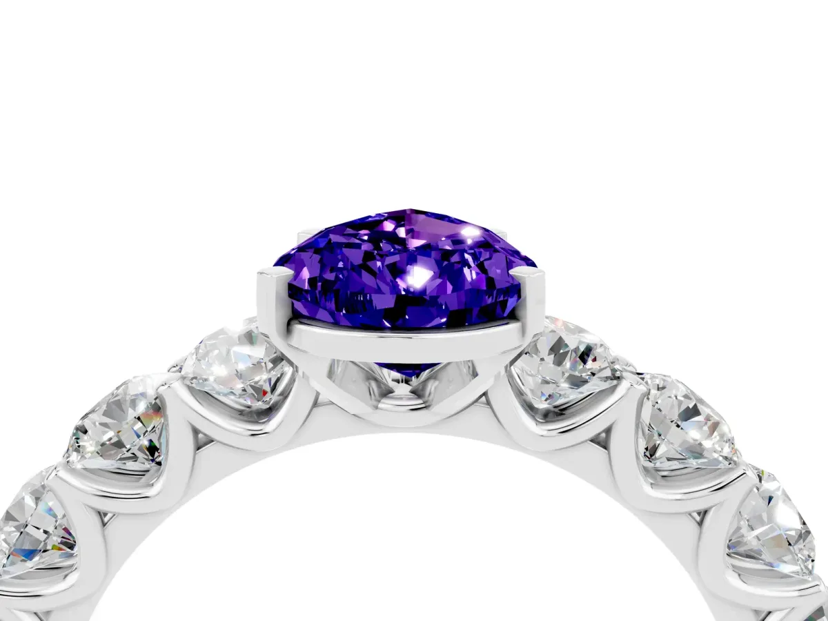 Pear Cut Tanzanite Prong Setting with Side Stones on a Pave Band Platinum