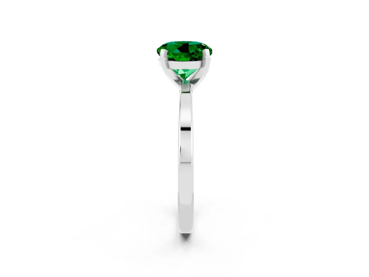 Round Cut Emerald Solitaire Engagement Ring with Classic Band and Four-Prong Setting Silver