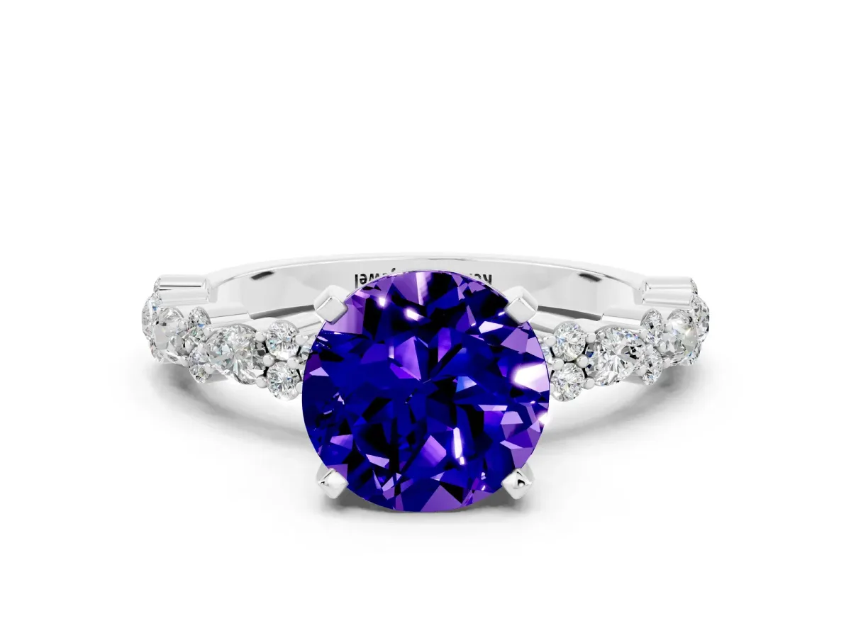 Round Cut Tanzanite Side Stone Solitaire Ring with Round and Four-Prong Setting Silver