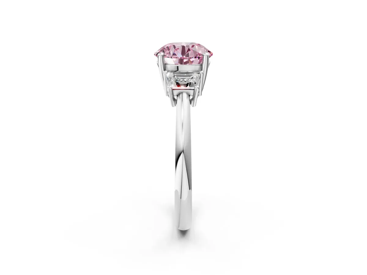 Fancy Pink Round Cut Diamond Three-Stone Ring with Trapezoid Side Stones and Prong Setting Platinum
