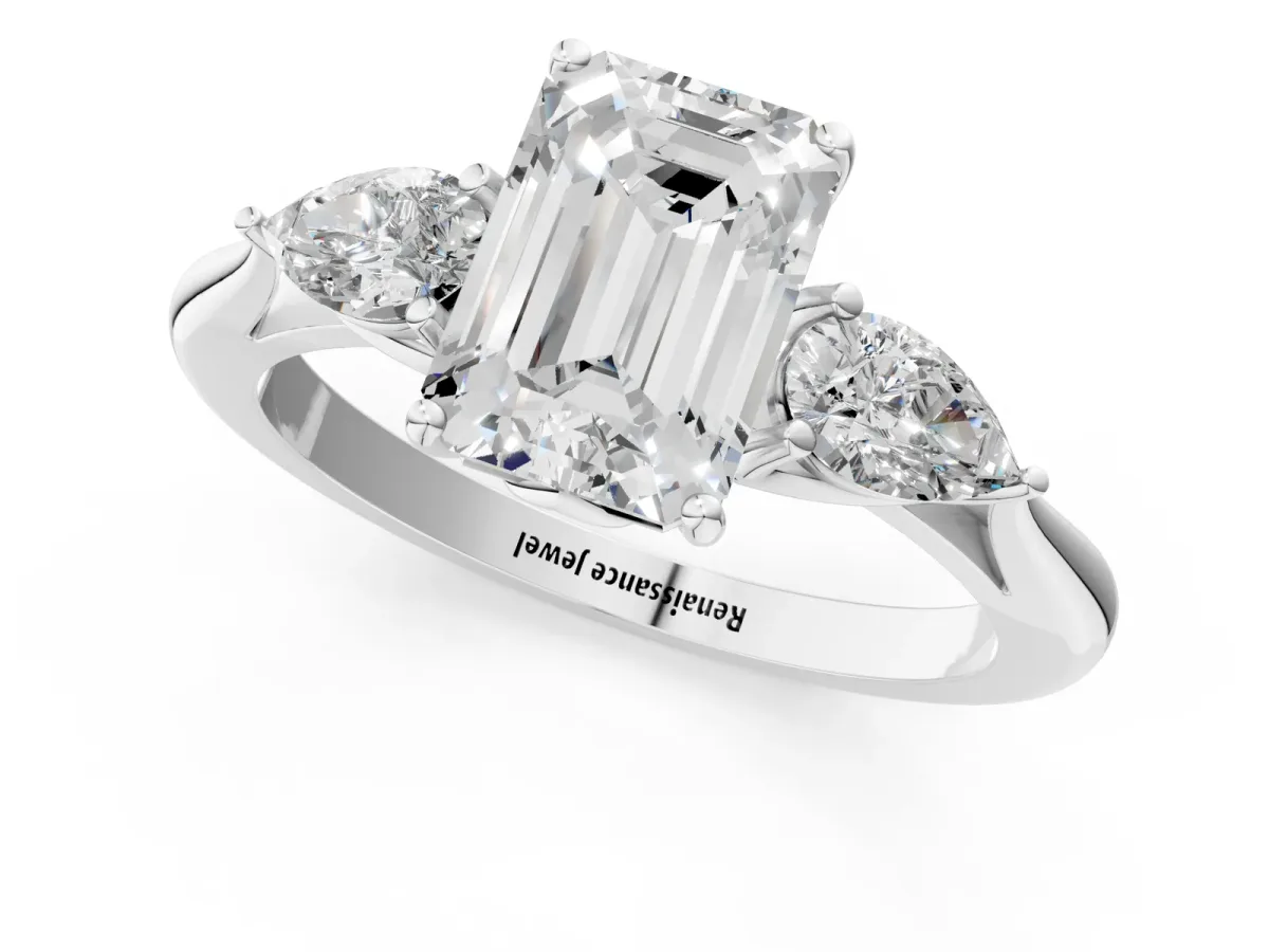 Three-Stone Emerald Cut Diamond Ring with Pear Side Stones in Four-Prong Setting White gold