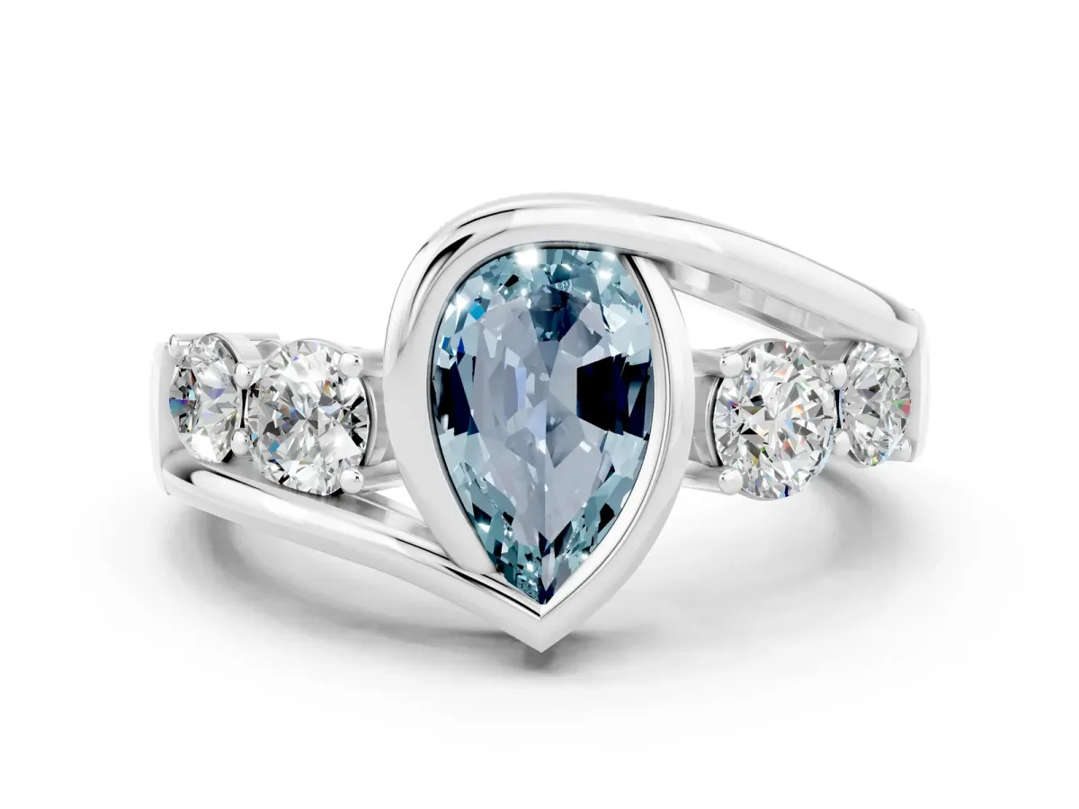 Bezel Set Pear Cut Aquamarine Bypass Ring with Round Accents Silver