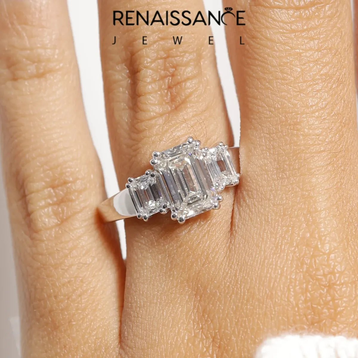 Three-Stone Oval Cut Cut Diamond Ring with Channel Set Band and Four-Prong Setting Silver