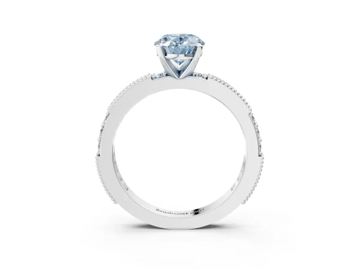 Fancy Blue Oval Cut Solitaire with Pavé Band and Four-Prong Setting Silver
