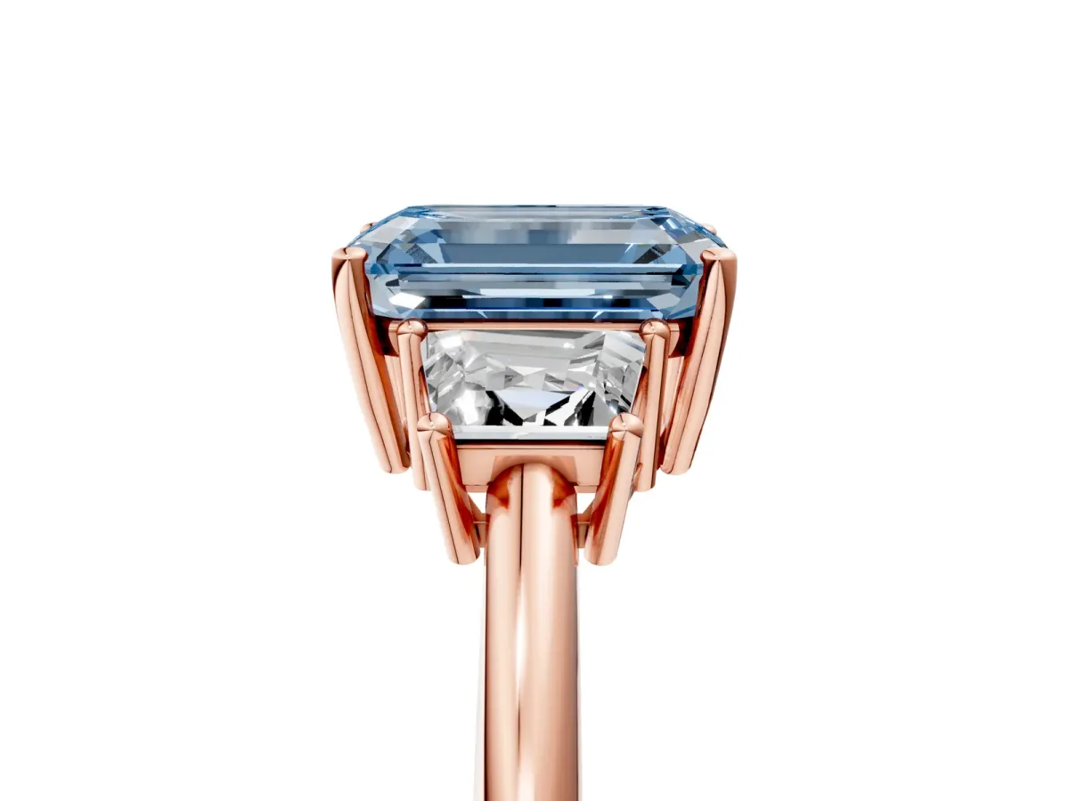 Fancy Blue Emerald Cut Diamond Three-Stone Ring with Trapezoid Side Stones and Prong Setting Rose gold
