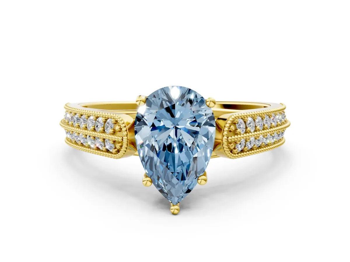 Fancy Blue Pear Cut Cut Pave Split Shank Engagement Ring with Four-Prong Setting Yellow gold