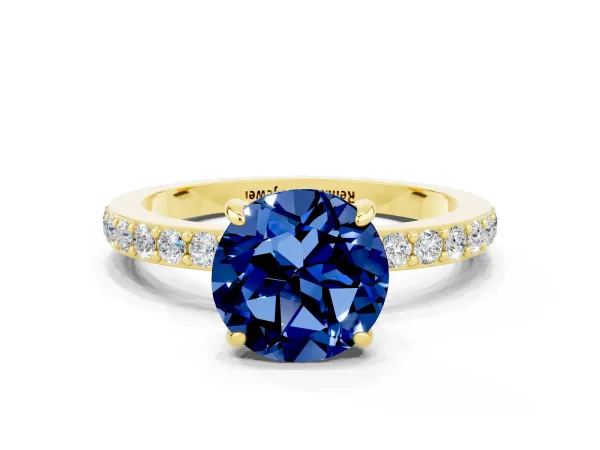 Round Cut Blue Sapphire Solitaire Engagement Ring with Pavé Band and Four-Prong Setting Yellow gold
