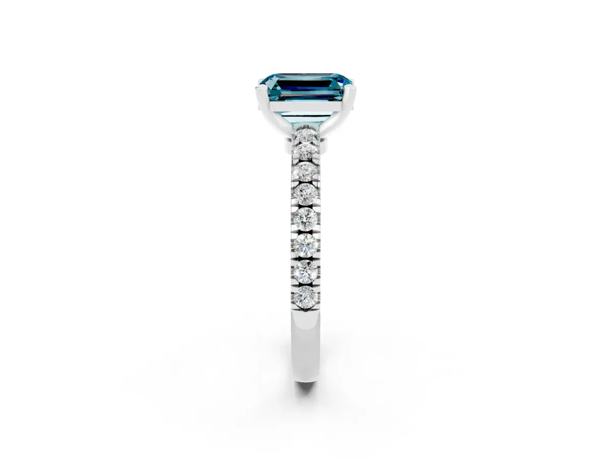 Emerald Cut Solitaire Blue Topaz with Pavé Band and Four-Prong Setting Silver